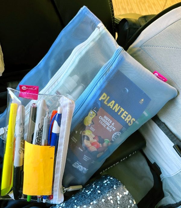 Image of clear pouch holding pencils, and three-section zipper pouch for snacks and healthcare items.