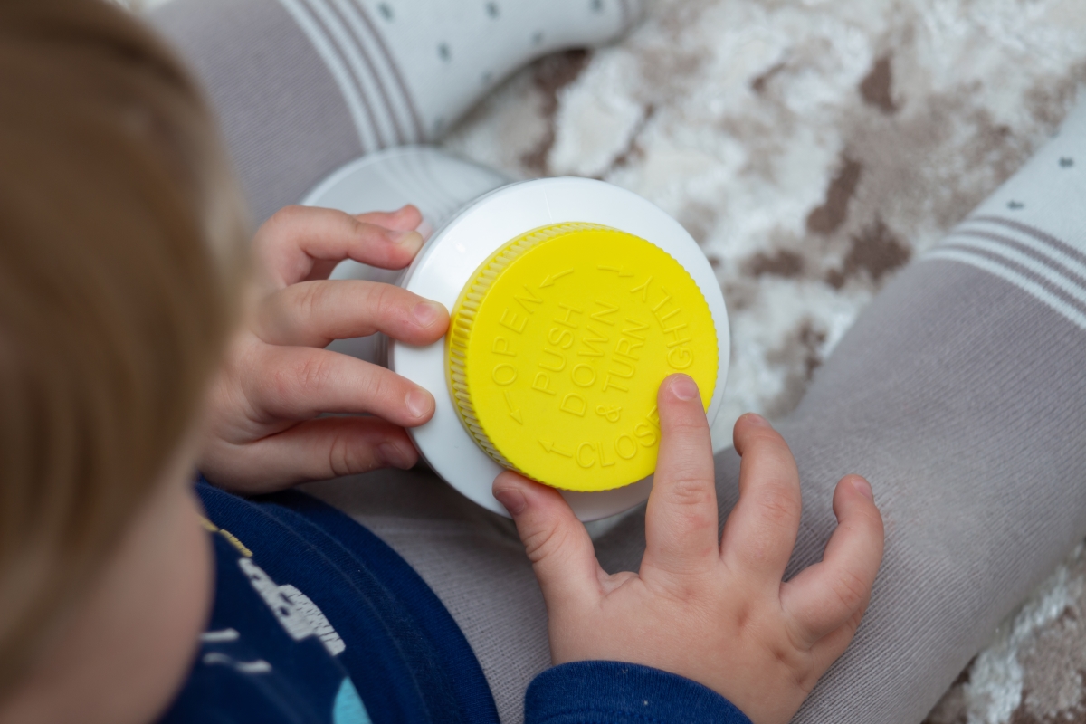 little girl reaching for chemicals